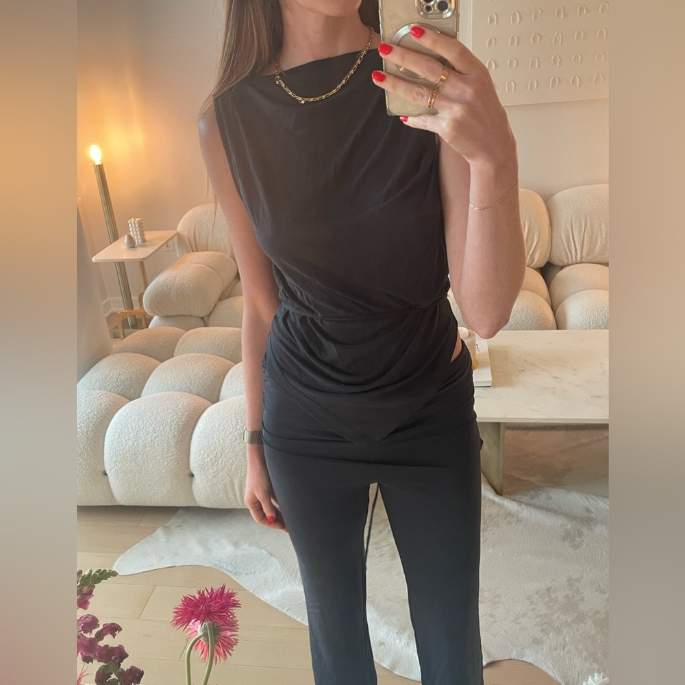 Elegant Black Sleeveless Tank Top and folded pants